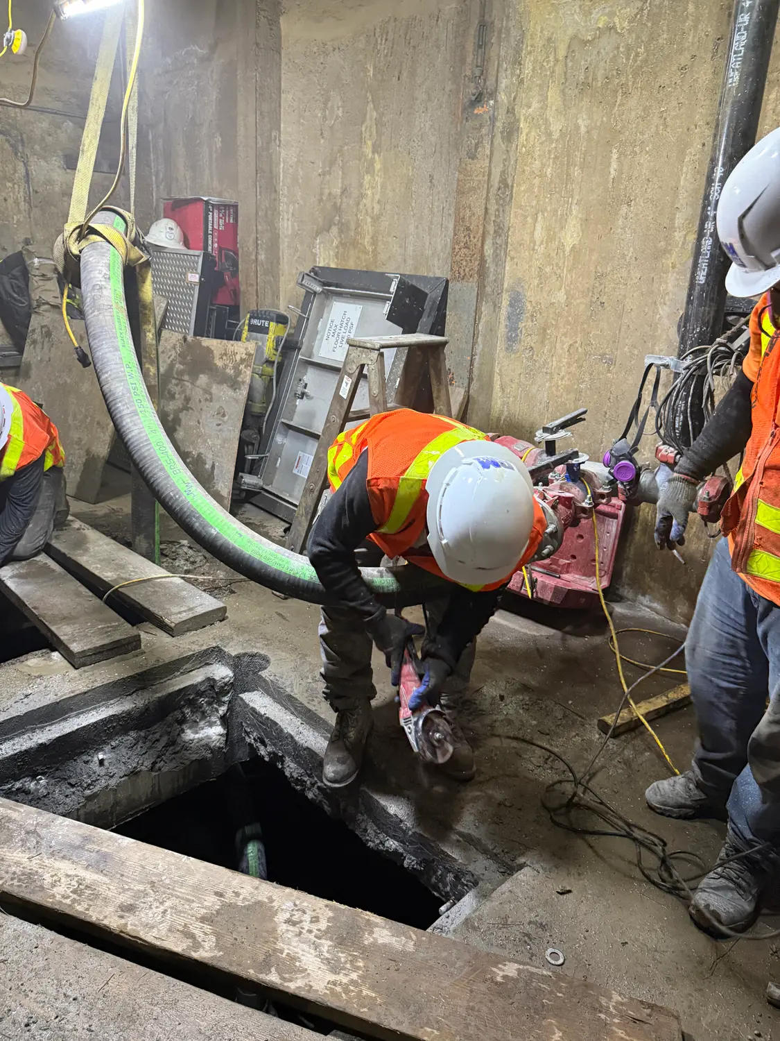 DM Safety Consulting site safety manager monitoring confined space work on a New York City construction project